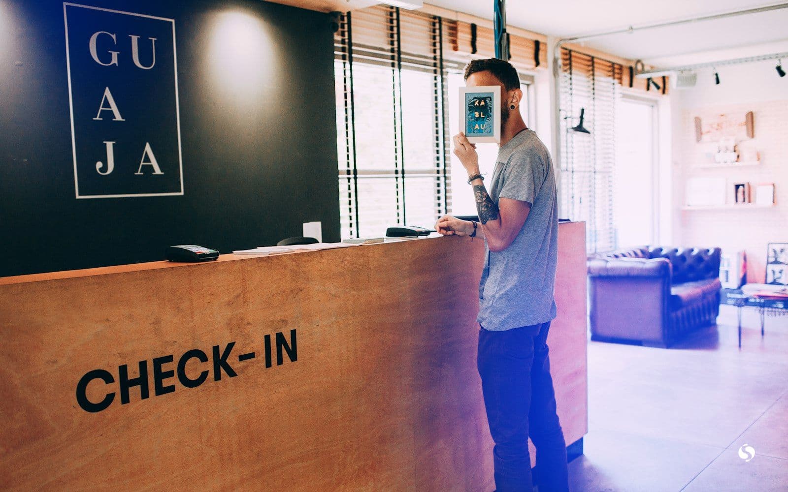 A guest standing at the reception counter