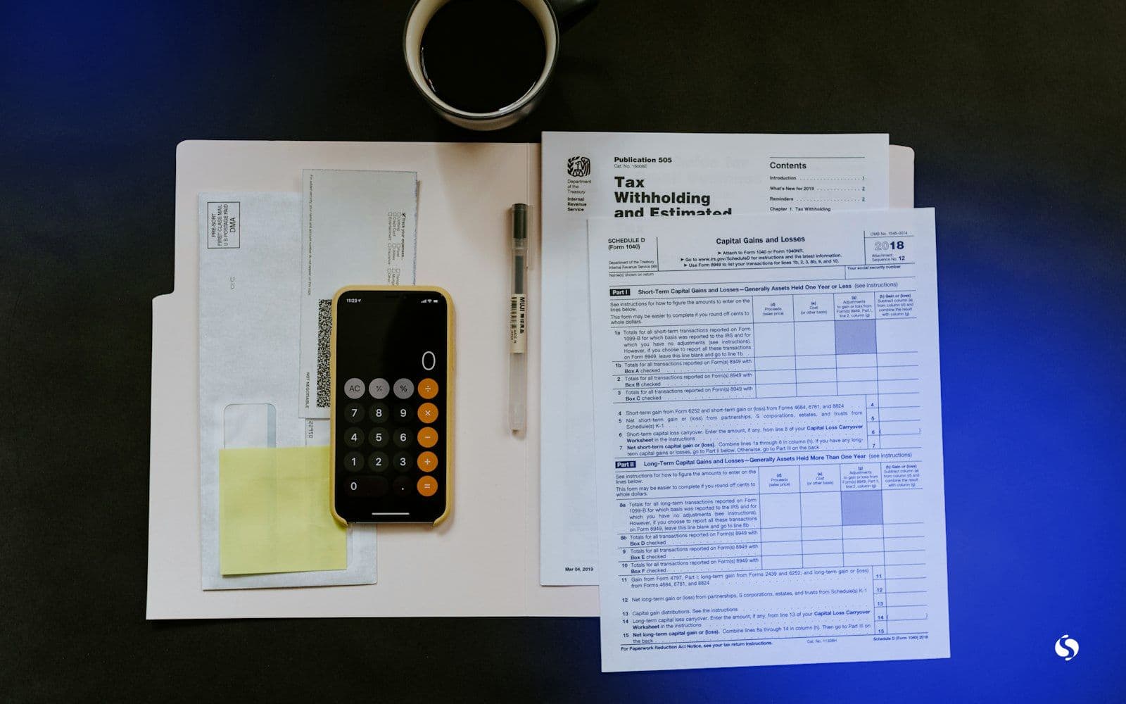 A phone, a pen and expense paperwork on a white folder